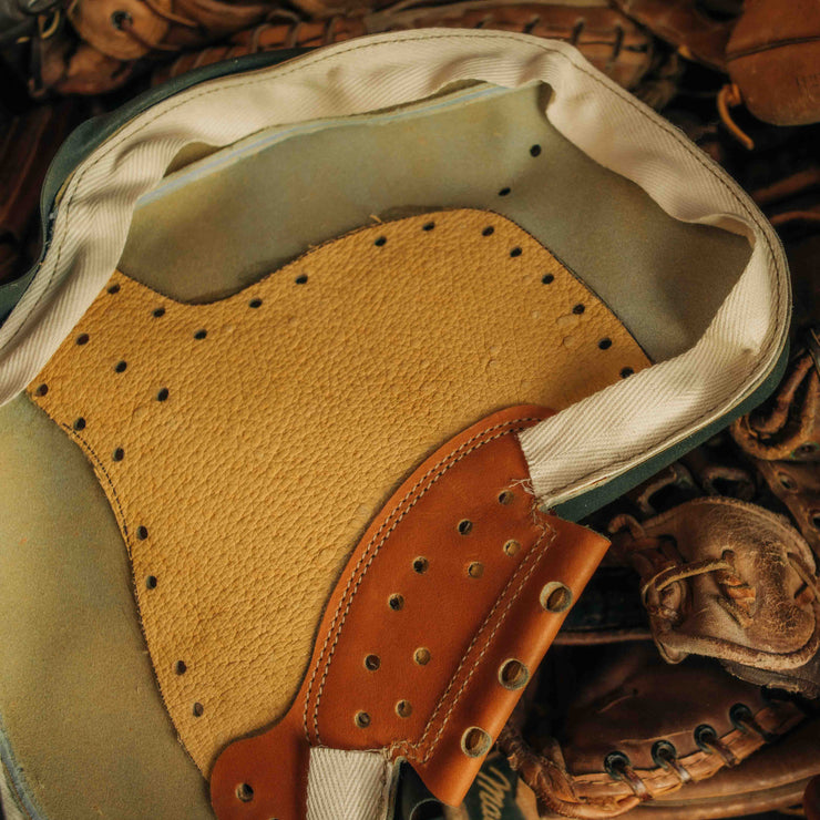 Heavy-duty lacing and edge binding on The Tank mitt for enhanced structural integrity